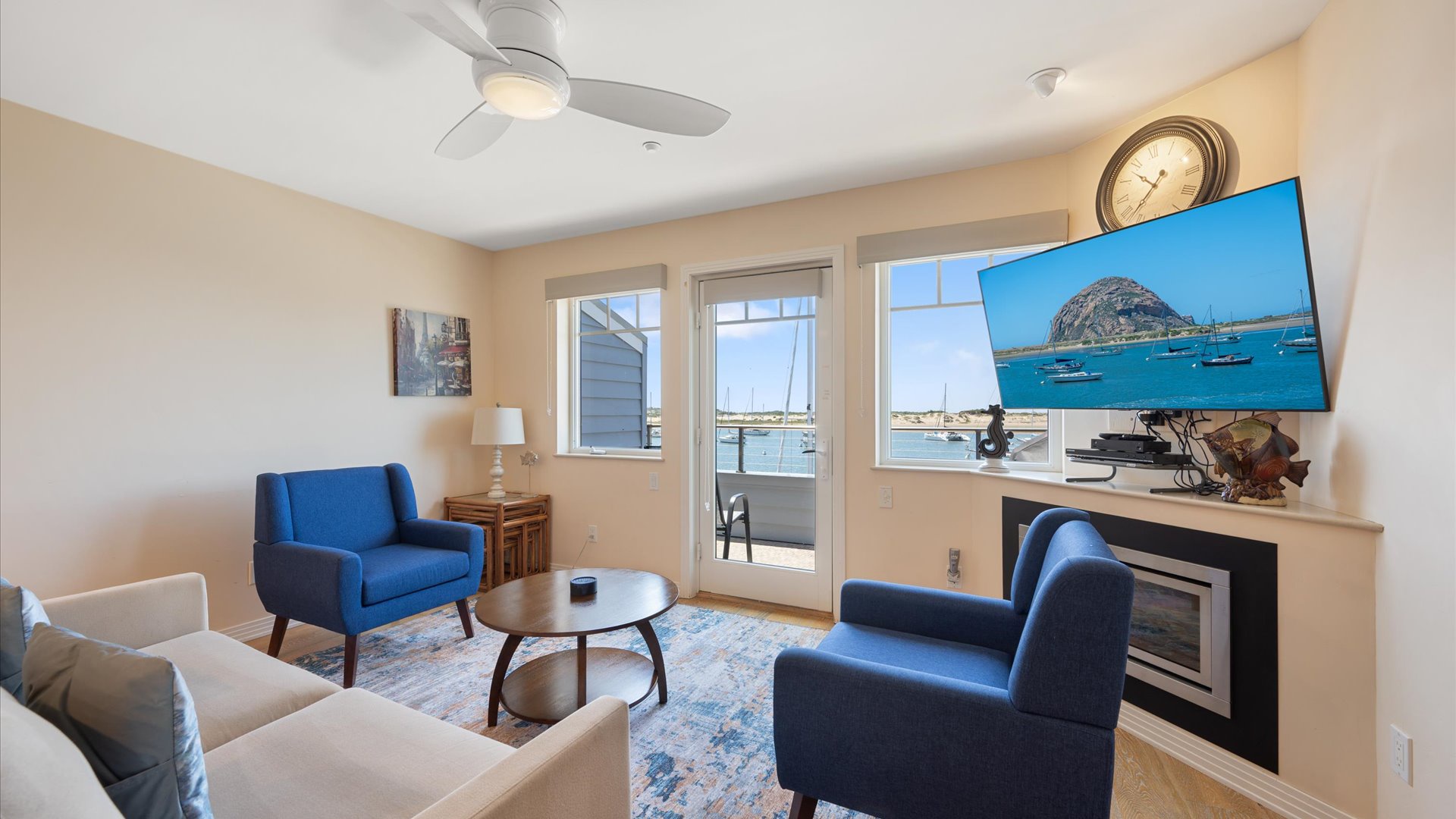 The living room has access to the balcony plus fireplace, flat screen tv, and stellar views