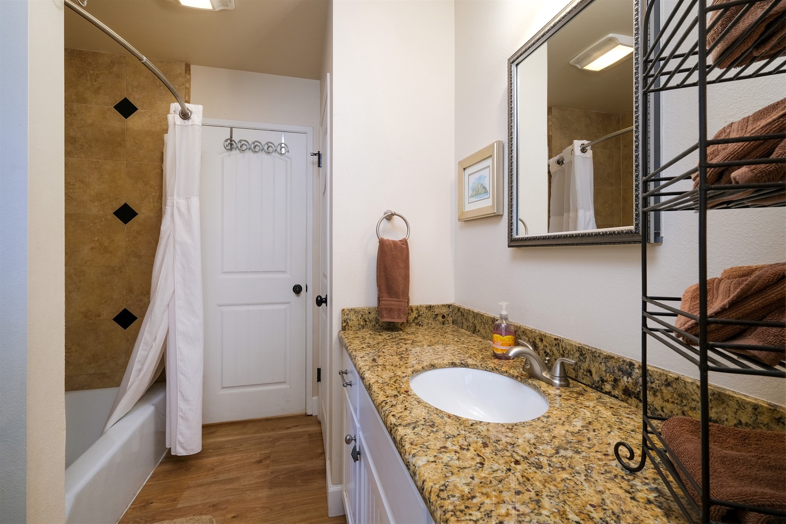 The 2nd bathroom is accessible from both the 2nd bedroom and the den area.