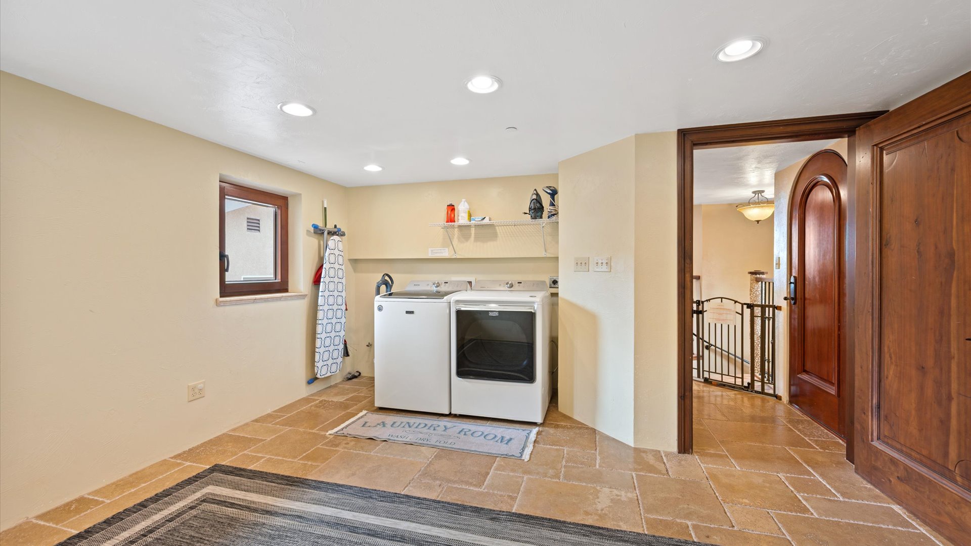 Laundry room with washer and dryer for guest use
