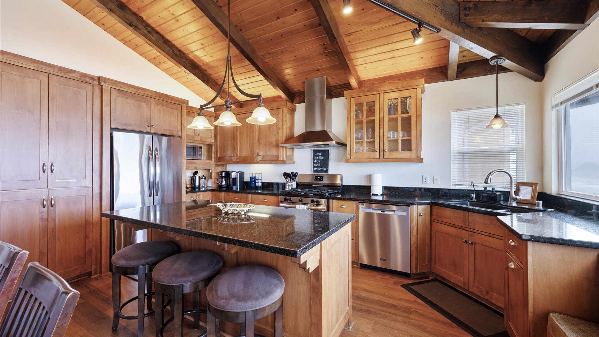The kitchen has granite countertops, lots of space to move around and great views.