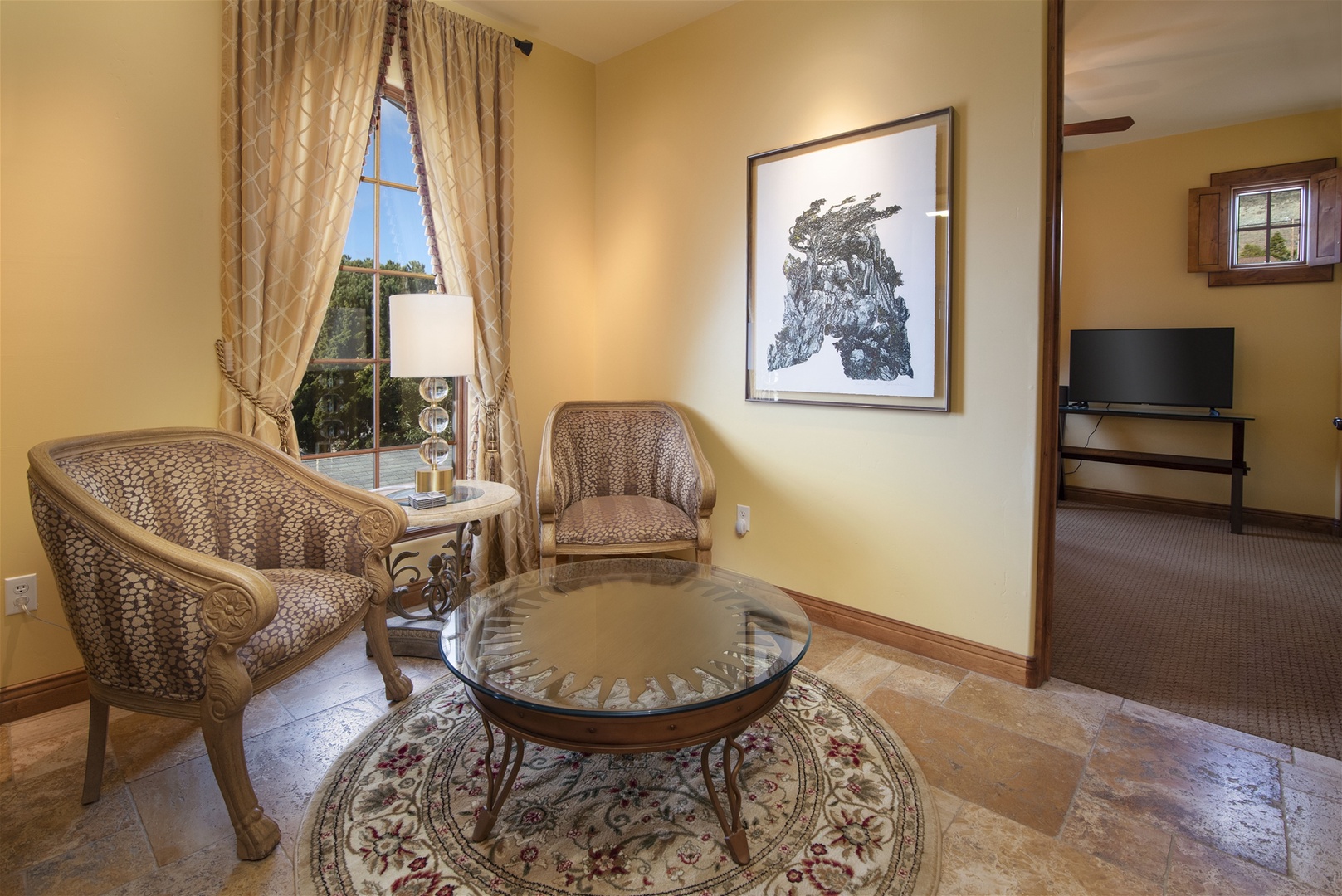 This small landing that connects the two upstairs bedrooms and full bathroom offers comfortable seating