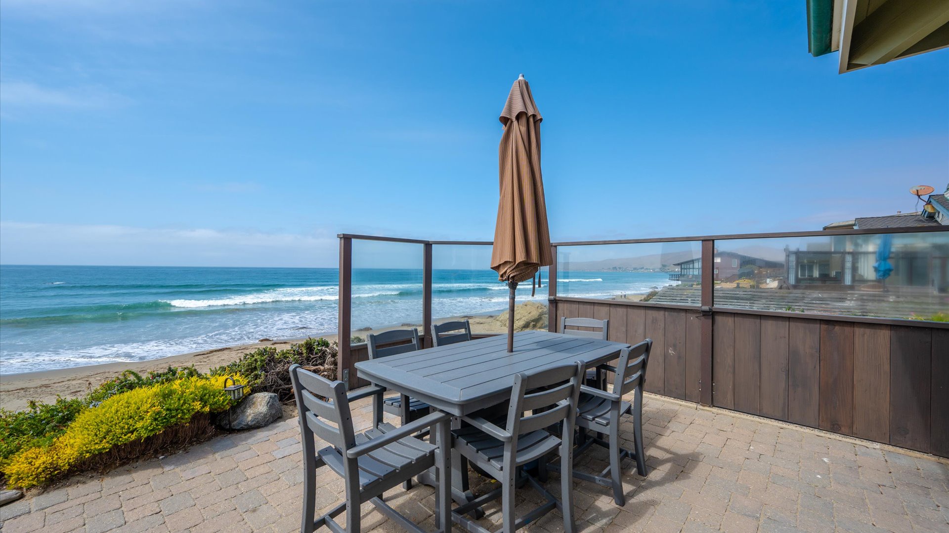 Imagine waking to the sound of waves and stepping onto your private patio, where morning coffee meets endless ocean views