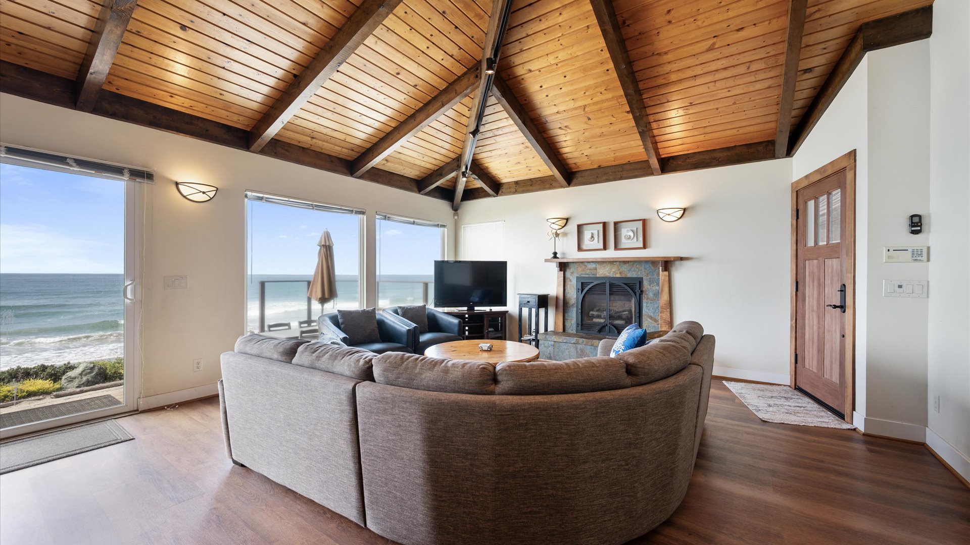 Living room also offers a flat screen TV and a cozy fireplace