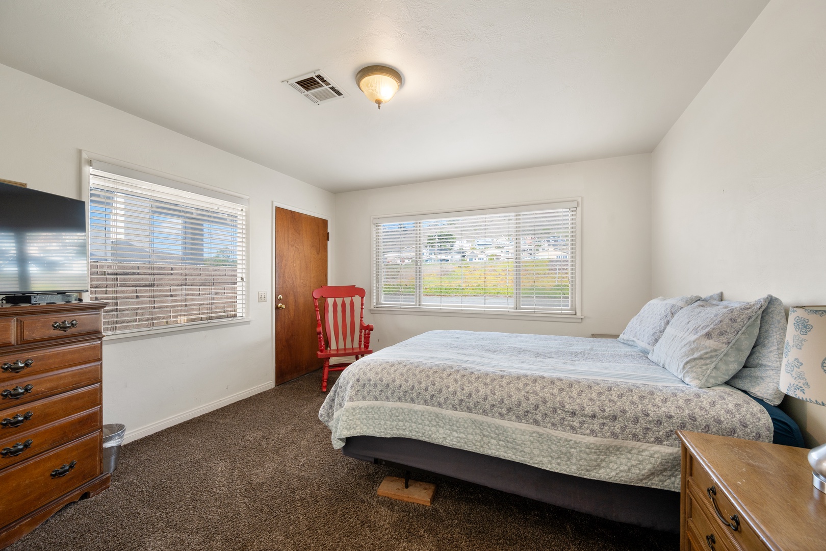 3rd bedroom upstairs features queen sized bed and tv