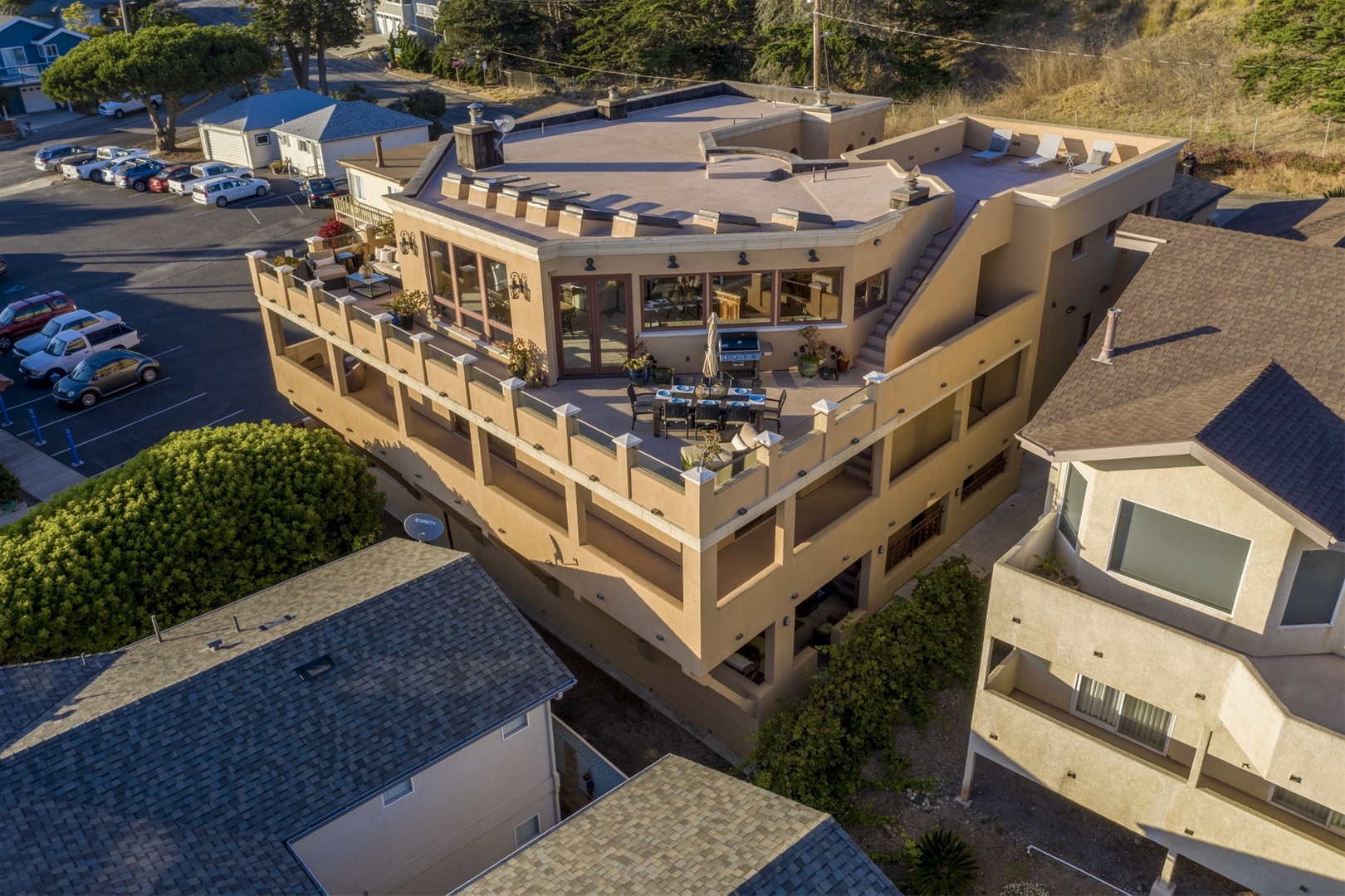 Arial view of this stunning home featuring the multiple deck areas