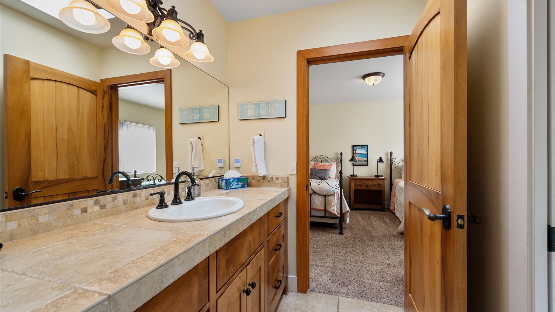The Jack and Jill  bathroom has a shower and is shared by the twin bedroom and the queen bedroom.