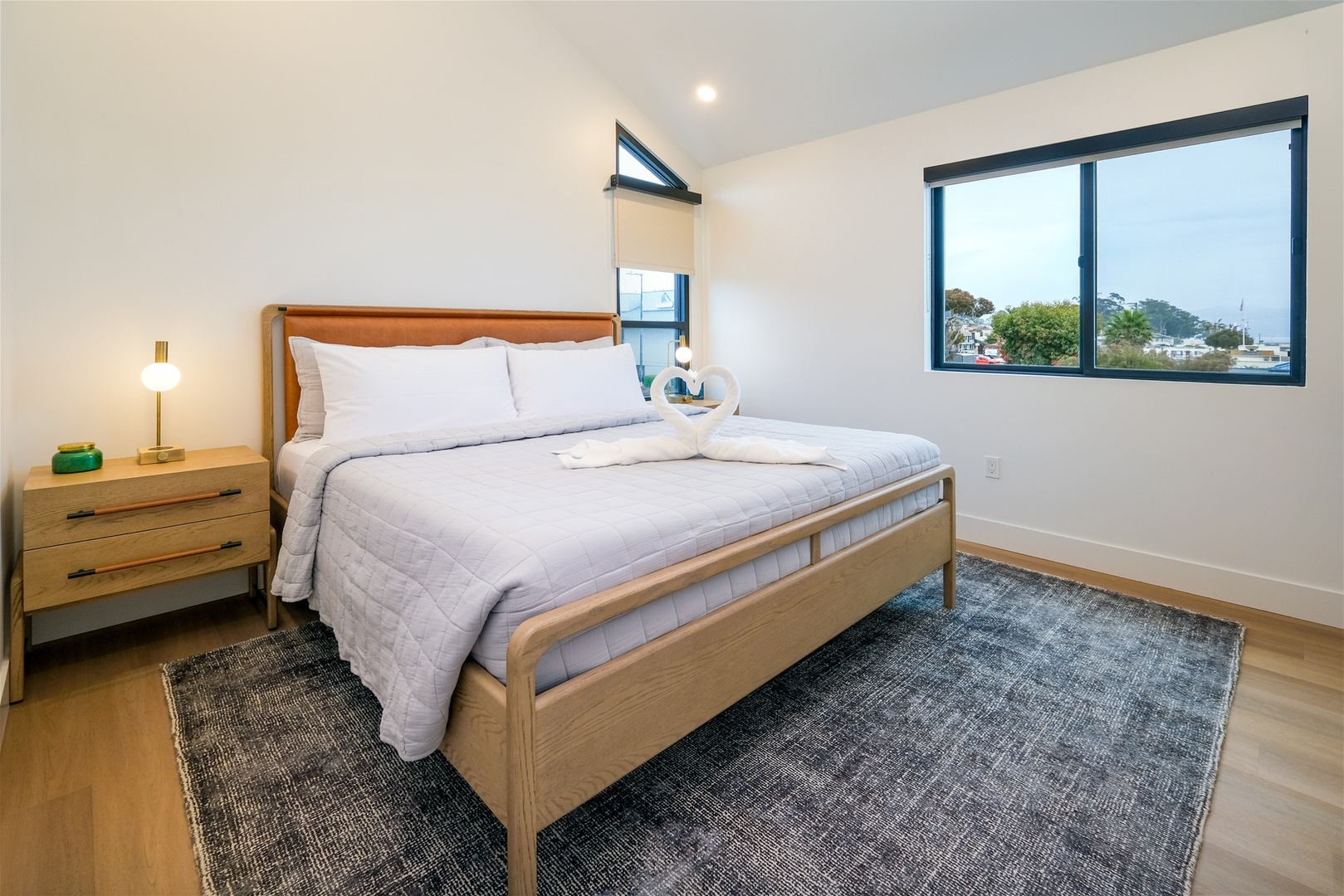 Retreat to the bedroom featuring a king sized bed