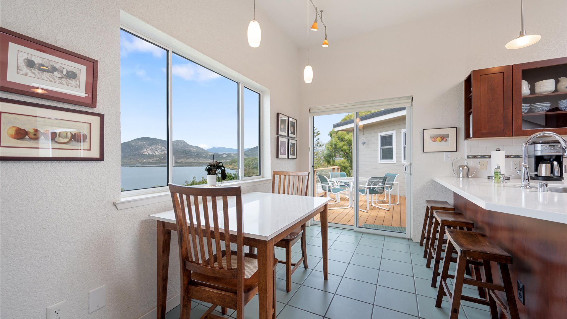 The open kitchen flows to your private deck, where you can sip coffee surrounded by peaceful scenery.