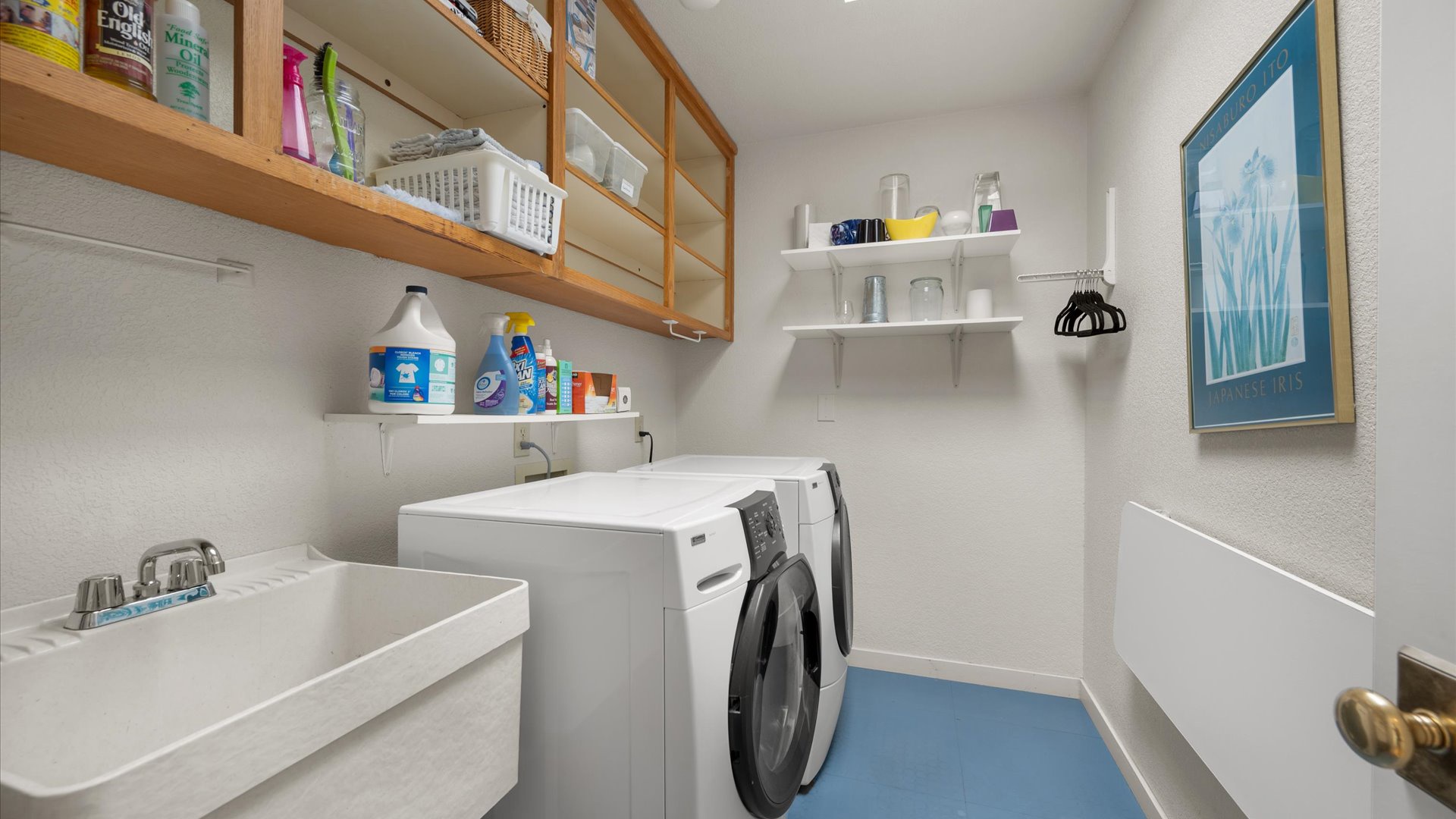 Laundry room with washer and dryer for guest use
