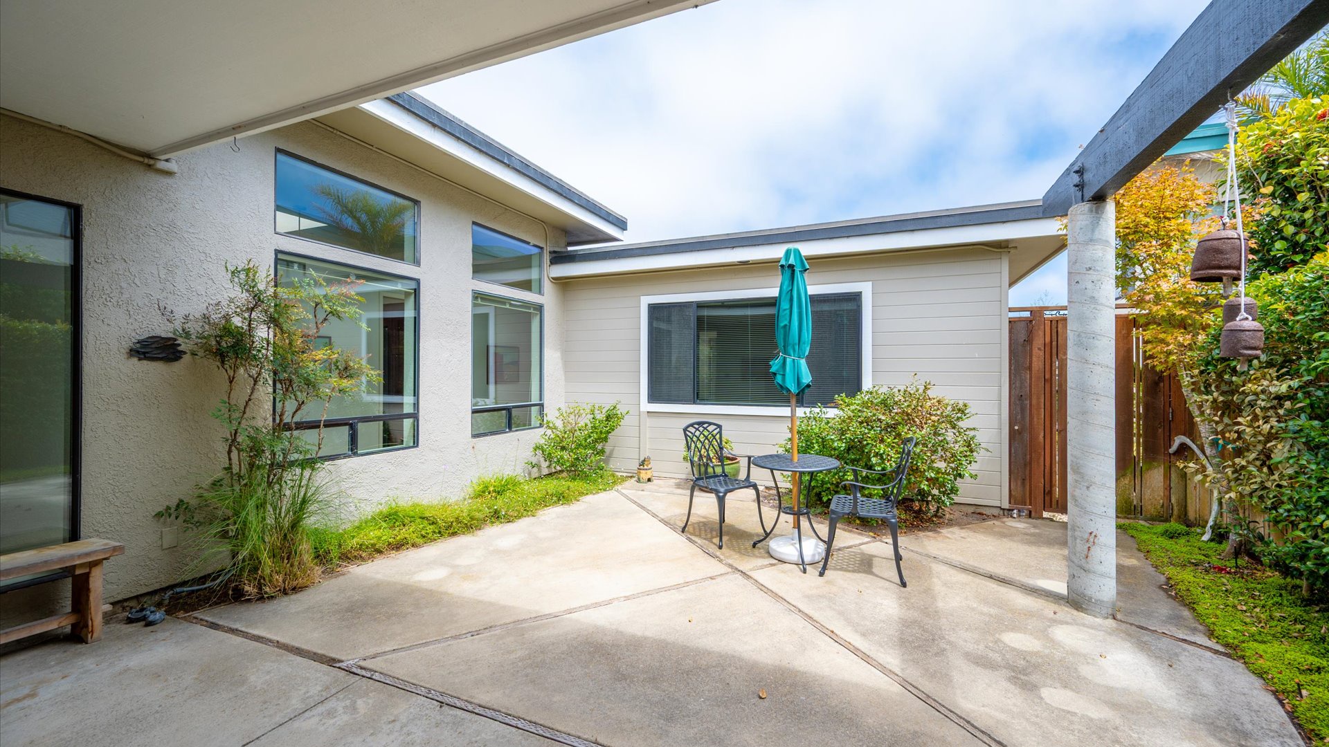 Step into your own private courtyard where morning coffee and sunny afternoons await