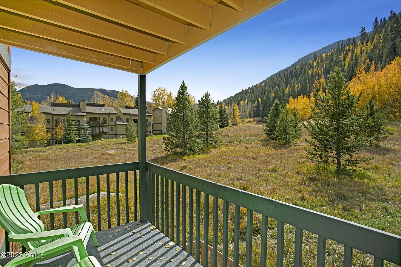 Step onto your private balcony and breathe in the crisp mountain air as you gaze at sweeping views of golden aspens and evergreen forests stretching across the valley.