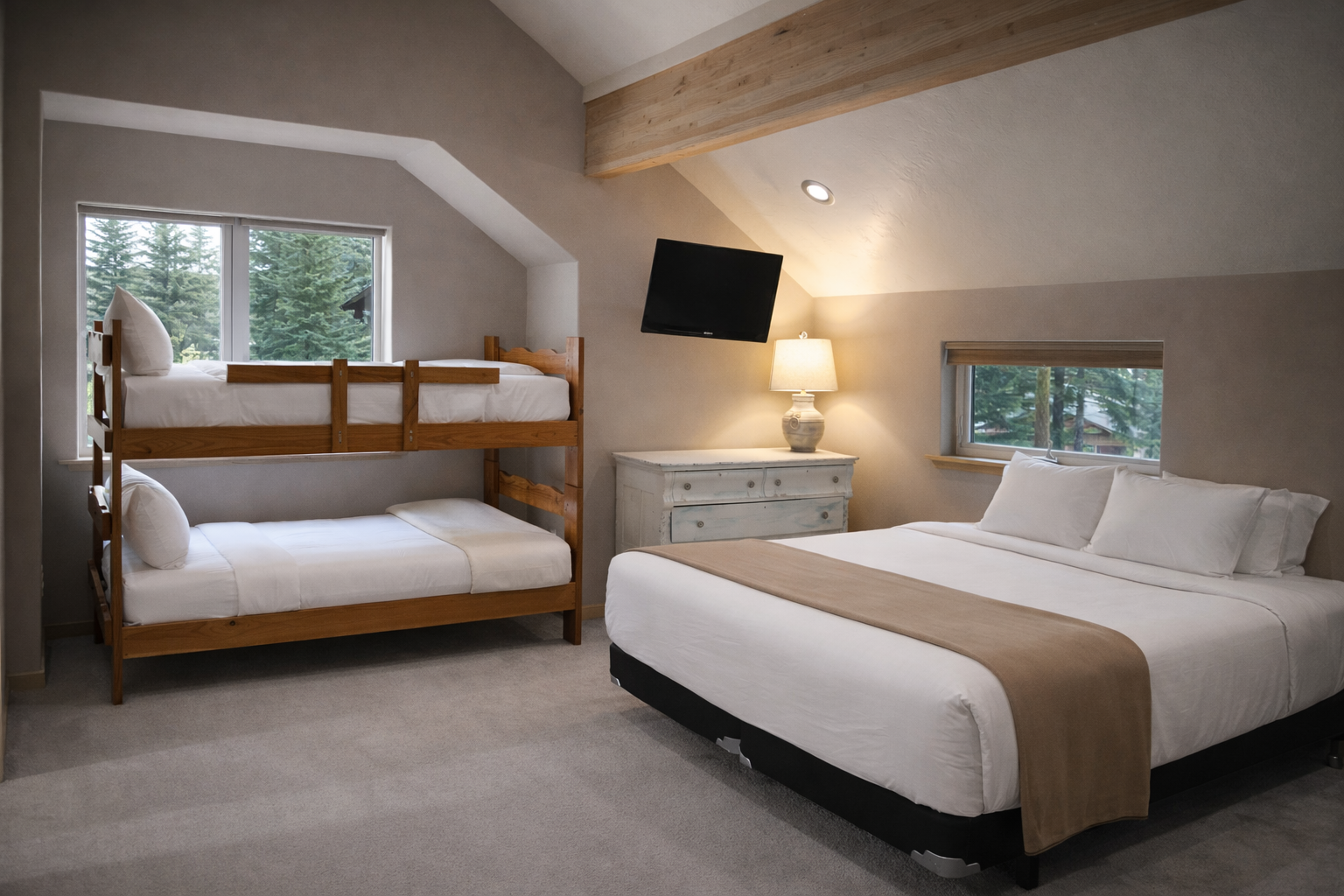 Your family retreat features a cozy bunk bed and comfortable king bed, with warm wood beams and peaceful forest views creating the perfect mountain escape.