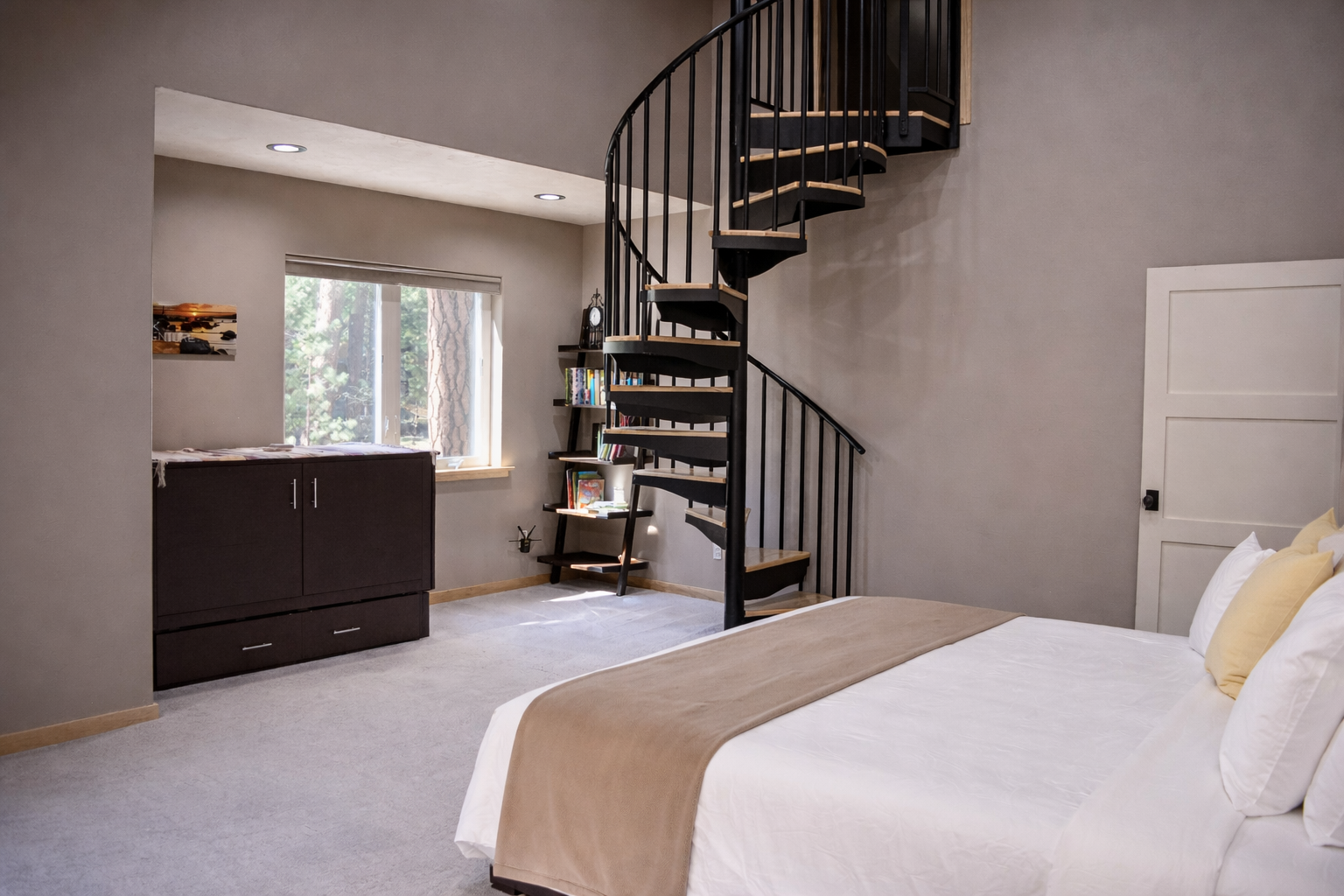 Your stylish bedroom features a dramatic spiral staircase, creating an airy loft feel with natural light streaming through windows.