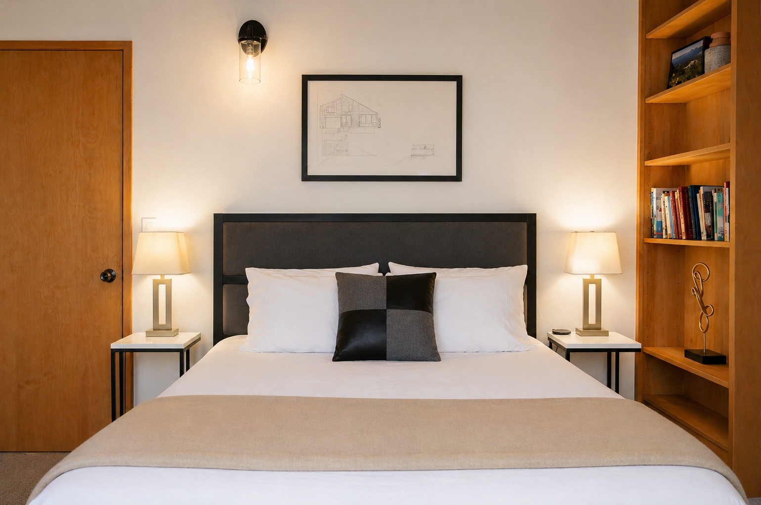 Sink into crisp white linens and let warm lighting create your perfect bedtime ambiance. Built-in shelves hold your favorite reads nearby.