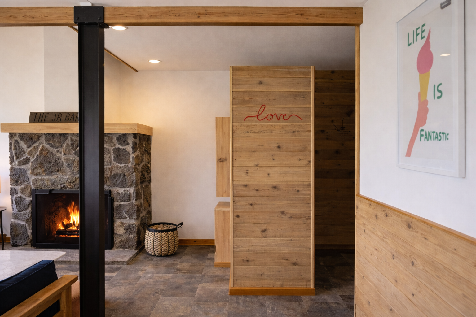 Cozy up by your crackling fireplace in this warm mountain retreat, where rustic stone meets modern comfort for perfect relaxation.
