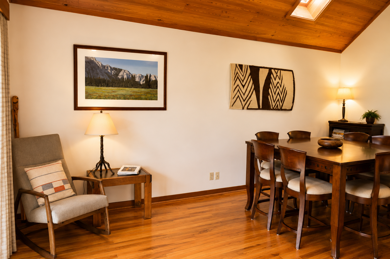 Gather around this warm dining space featuring rich wood tones, cozy seating, and handcrafted artwork that brings a mountain retreat feel to your stay.