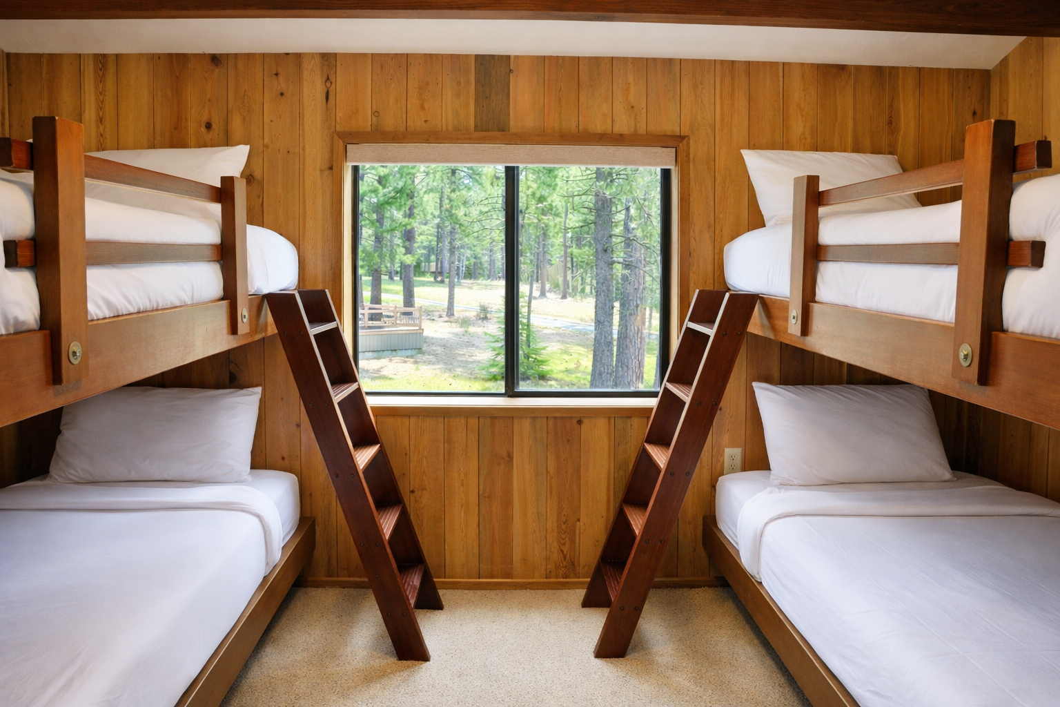 Sleep peacefully in your cozy bunk room with forest views right outside your window, perfect for family adventures.