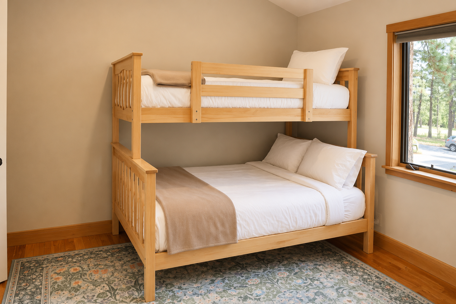 Your cozy retreat features a charming bunk bed with crisp white linens, perfect for families or groups. Warm wood tones and natural light create a welcoming, restful space for all.