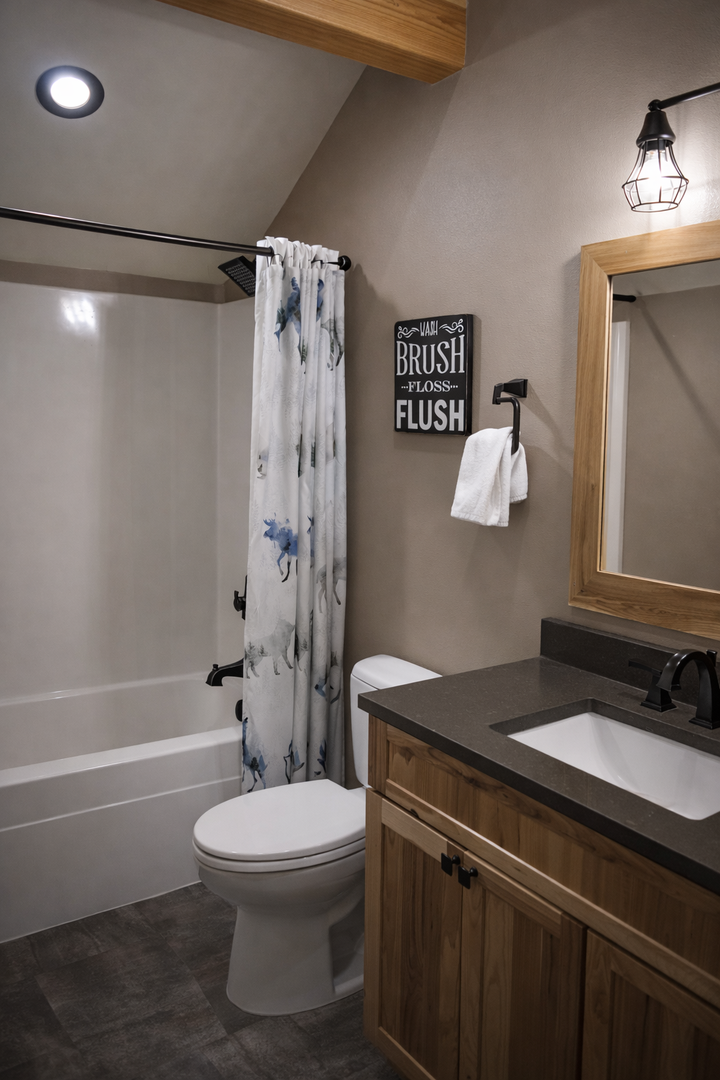 Your private bathroom features rustic charm with warm wood accents, modern amenities, and thoughtful touches for a comfortable stay.
