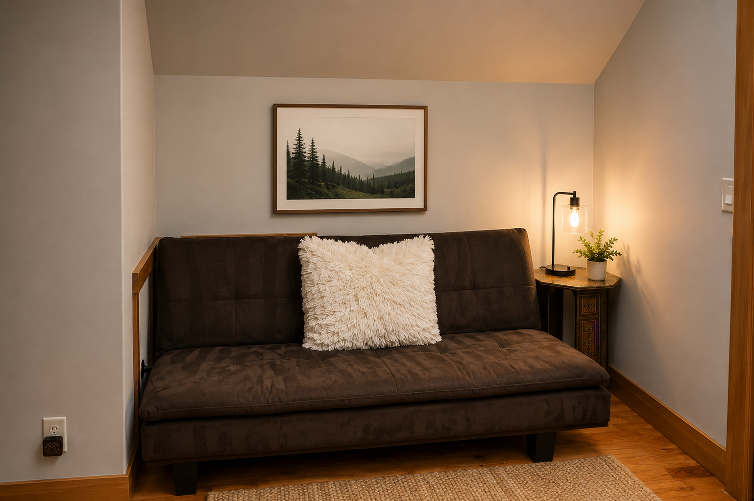 Unwind in your cozy nook, where soft lighting and a plush sofa invite you to relax after a day exploring the mountains just beyond your door.