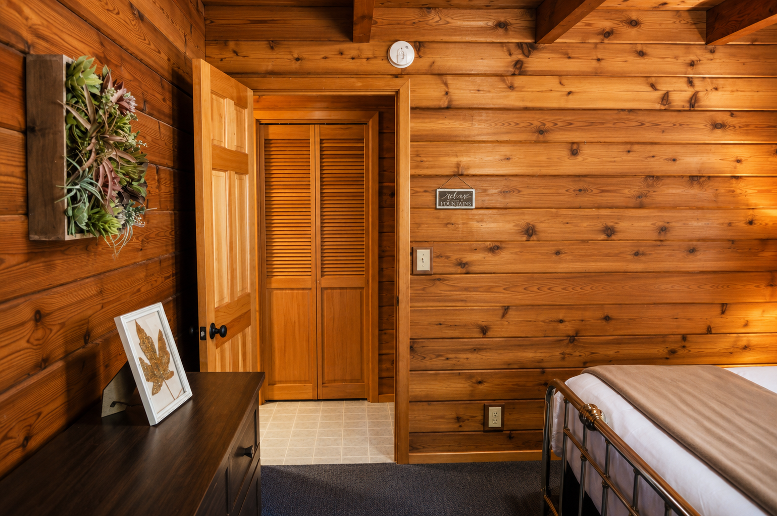 Step into your cozy mountain retreat where rustic wood surrounds you in natural warmth. The charming details and peaceful ambiance create the perfect space for unwinding after your adventures.