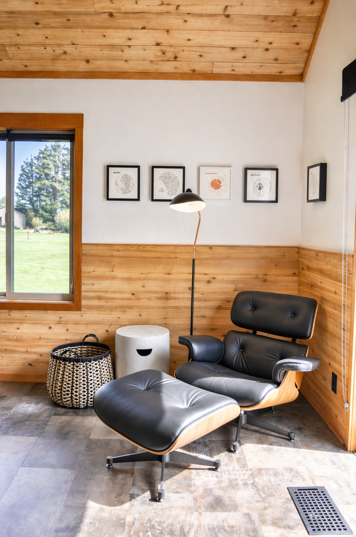 Sink into this iconic lounge chair with warm wood accents and modern design. Your perfect reading nook awaits.