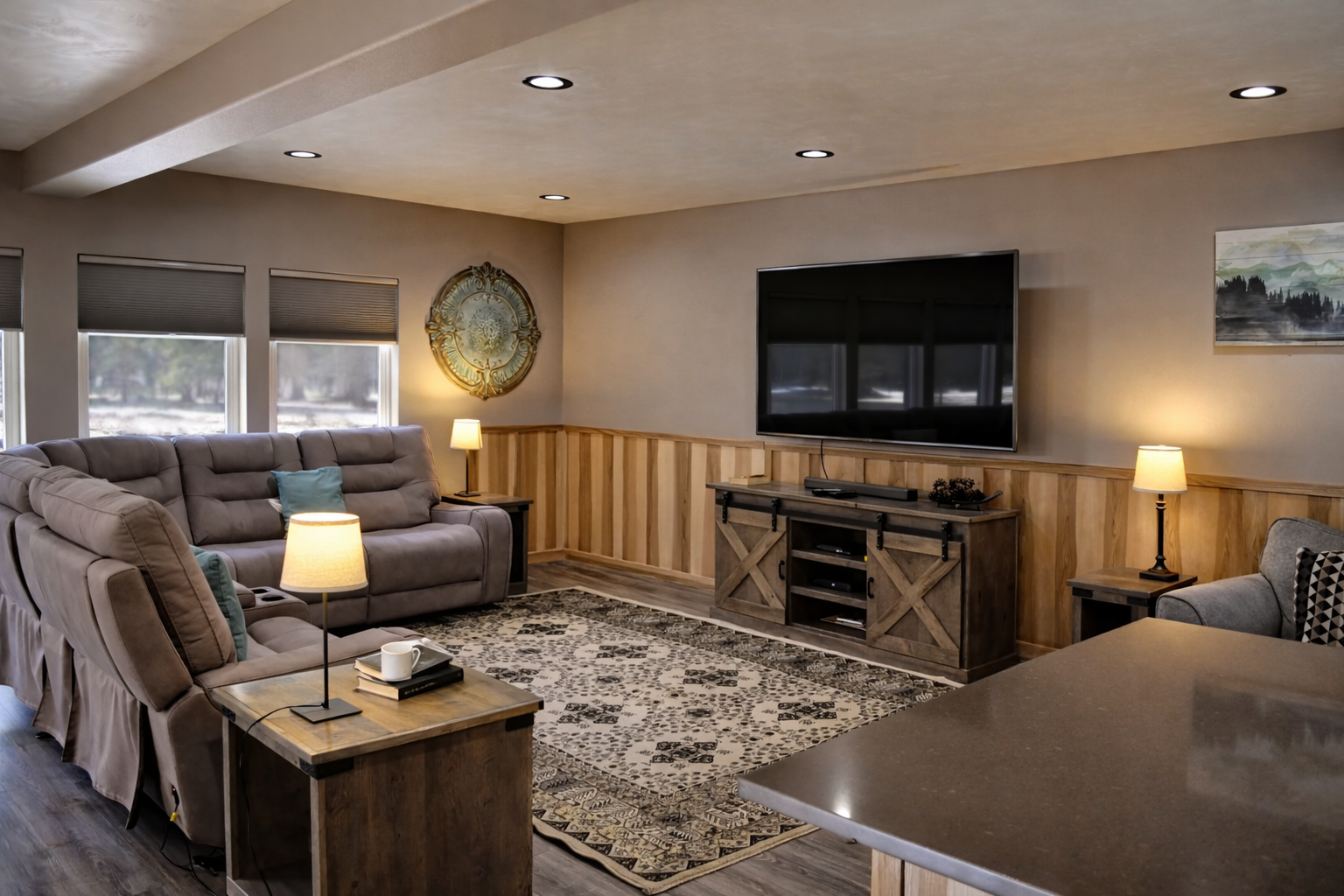 Sink into plush recliners and unwind in your spacious living room, complete with modern entertainment center and warm ambient lighting.