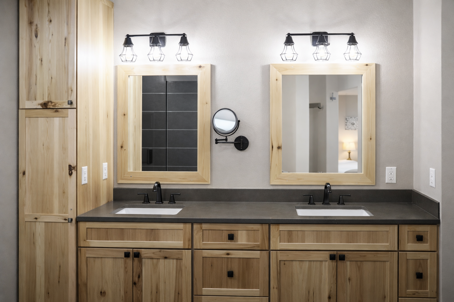 Unwind in your private bathroom featuring rustic wood vanity, dual sinks, and warm lighting for your morning routine.