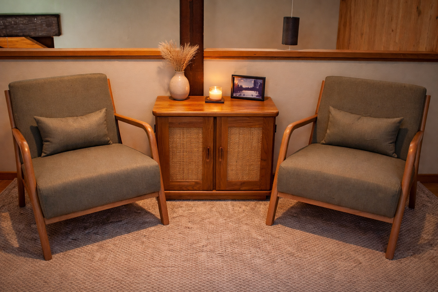 Sink into these cozy mid-century chairs for quiet moments with your morning coffee or evening read. The warm wood tones create a perfect retreat.