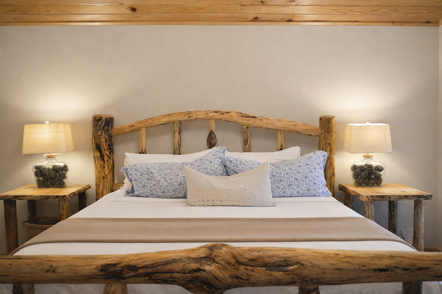 Drift into peaceful sleep surrounded by rustic wood beams and soft lighting that creates your perfect mountain retreat sanctuary.