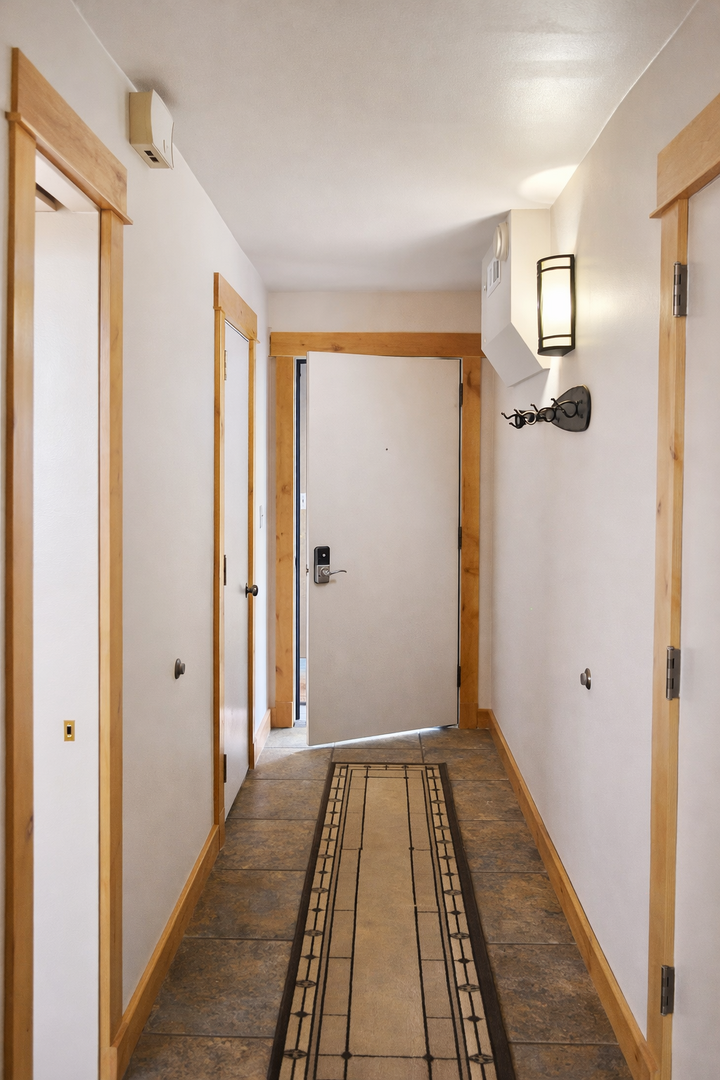 You'll appreciate the secure entrance with modern keyless entry and elegant lighting welcoming you into your comfortable stay.