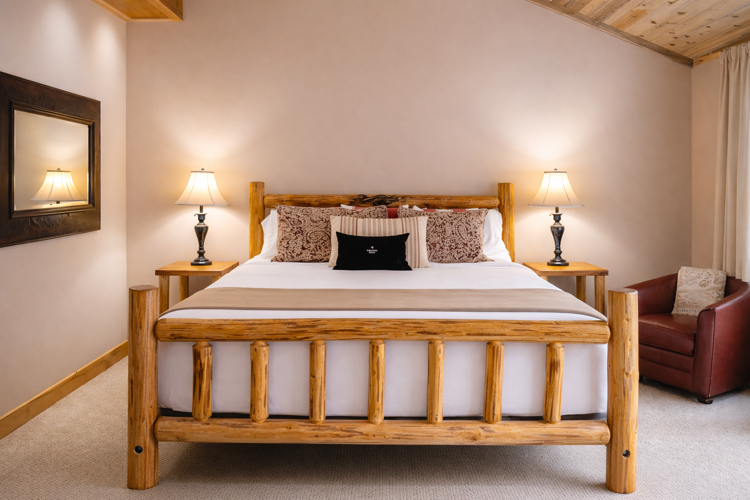 Unwind in your cozy bedroom featuring rustic wood furnishings, soft bedside lighting, and elegant decor that creates the perfect mountain retreat atmosphere.
