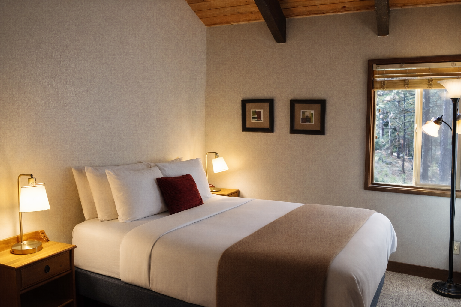 Rest peacefully in your cozy bedroom with exposed beams, crisp linens, and forest views through your private window.