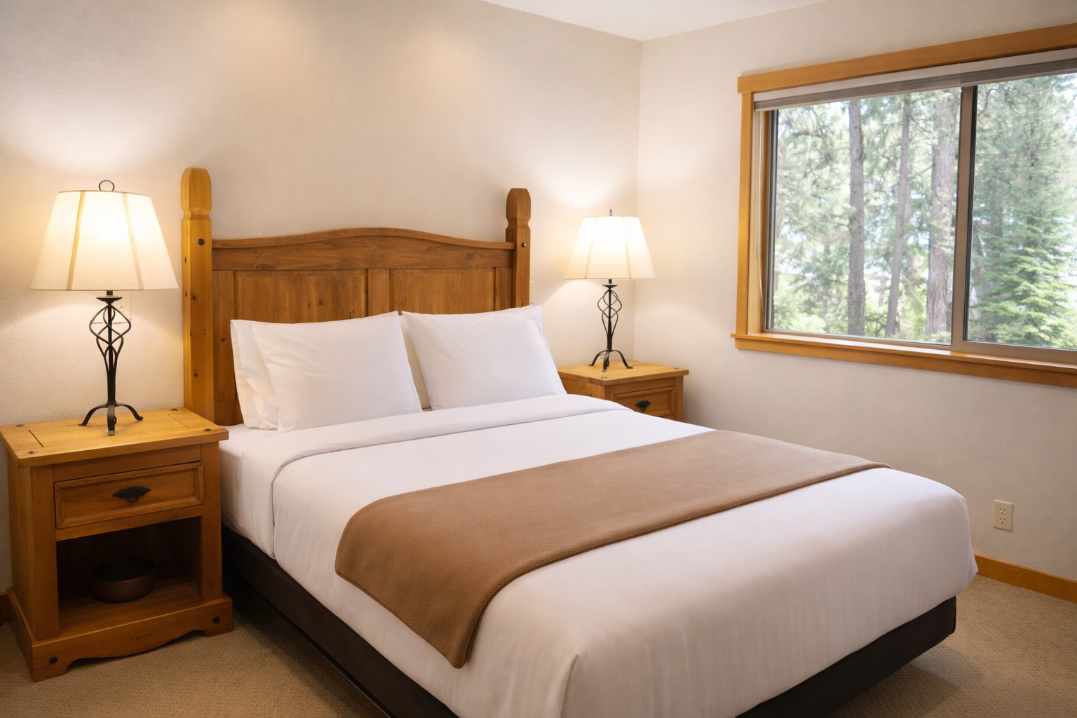 Rest peacefully in your cozy bedroom with crisp linens and warm wood furnishings, while forest views create a tranquil backdrop.