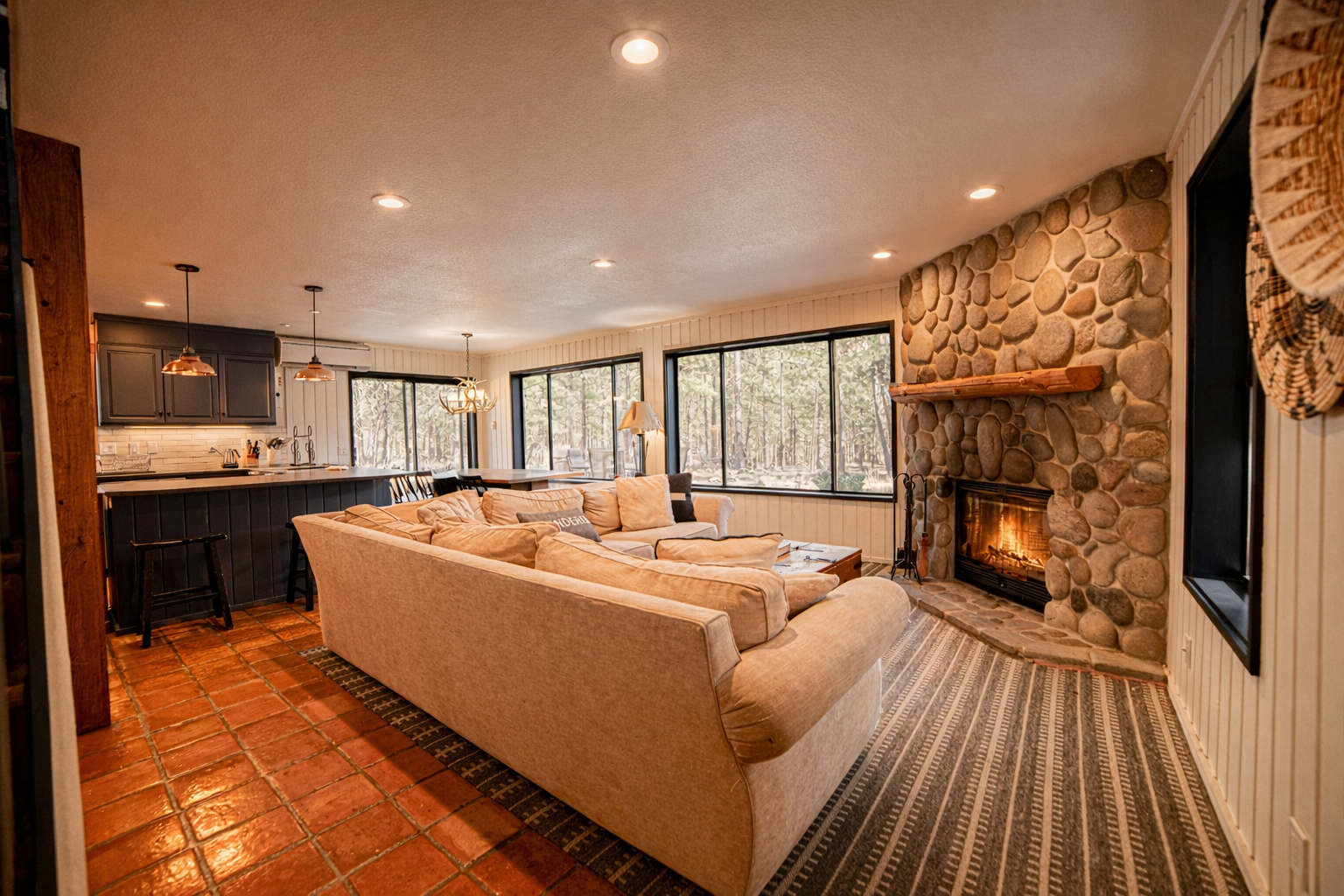 Cozy up in your spacious living room with a crackling stone fireplace, perfect for mountain evenings after adventures.