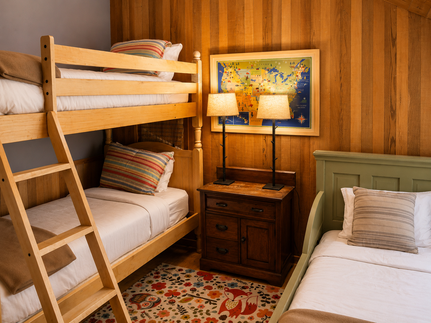 Gather the family in this cozy room where you'll find comfortable sleeping arrangements for everyone. The warm wood paneling and playful details create a welcoming retreat after your day's adventures.