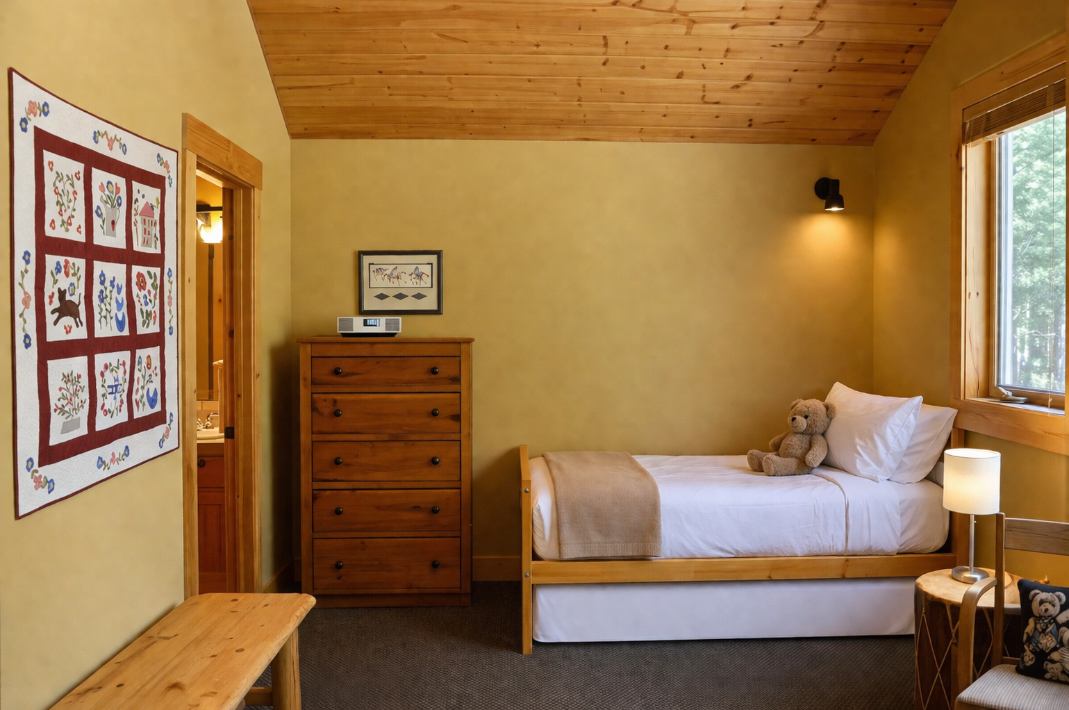 Your cozy retreat features warm wood ceilings, soft lighting, and thoughtful touches like teddy bears that make this space feel like home.