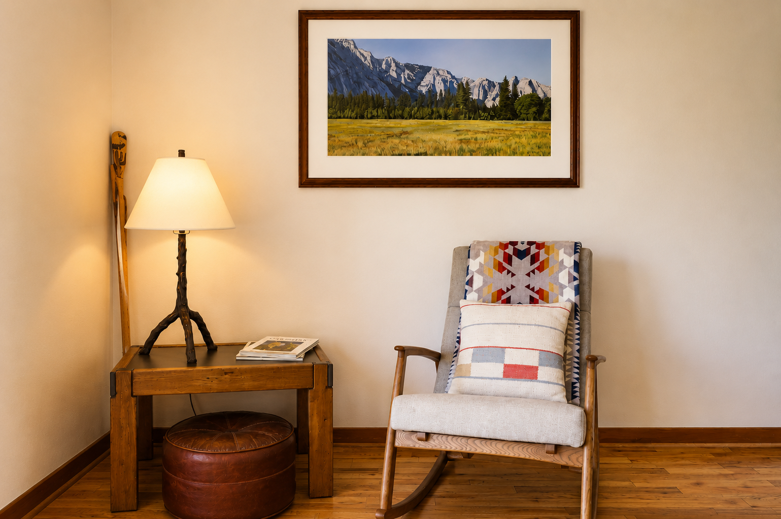 Settle into your cozy reading nook, where warm lighting and comfortable seating create the perfect spot to unwind and admire mountain artwork after a day of adventure.