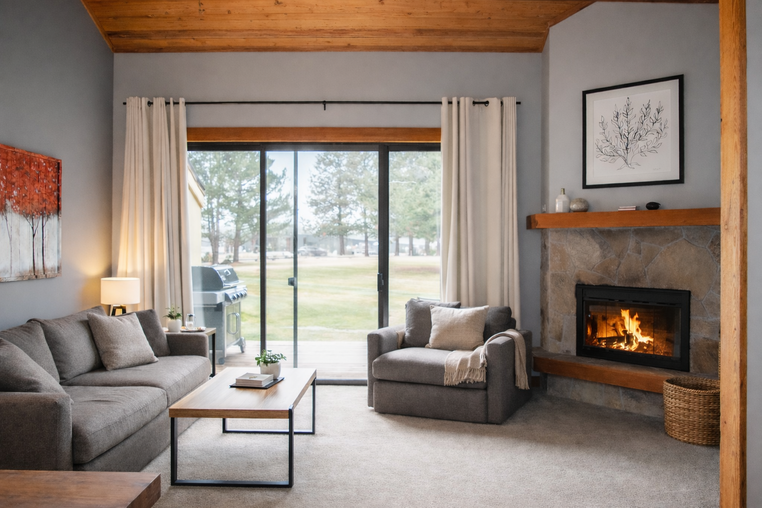 Sink into plush seating by your crackling fireplace, where warm wood beams and garden views create the perfect retreat.