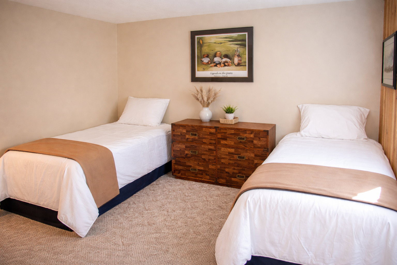 Rest peacefully in your twin bedroom with comfortable beds, thoughtful decor, and warm natural light creating a cozy retreat.