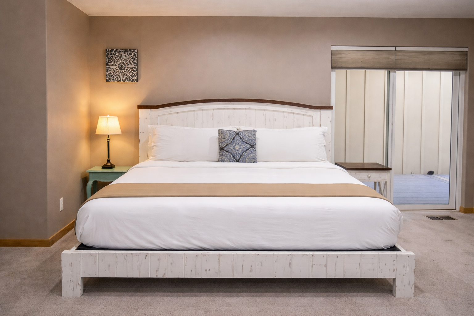 Drift into peaceful slumber on this luxurious king bed with crisp linens and soft lighting creating your perfect sanctuary.