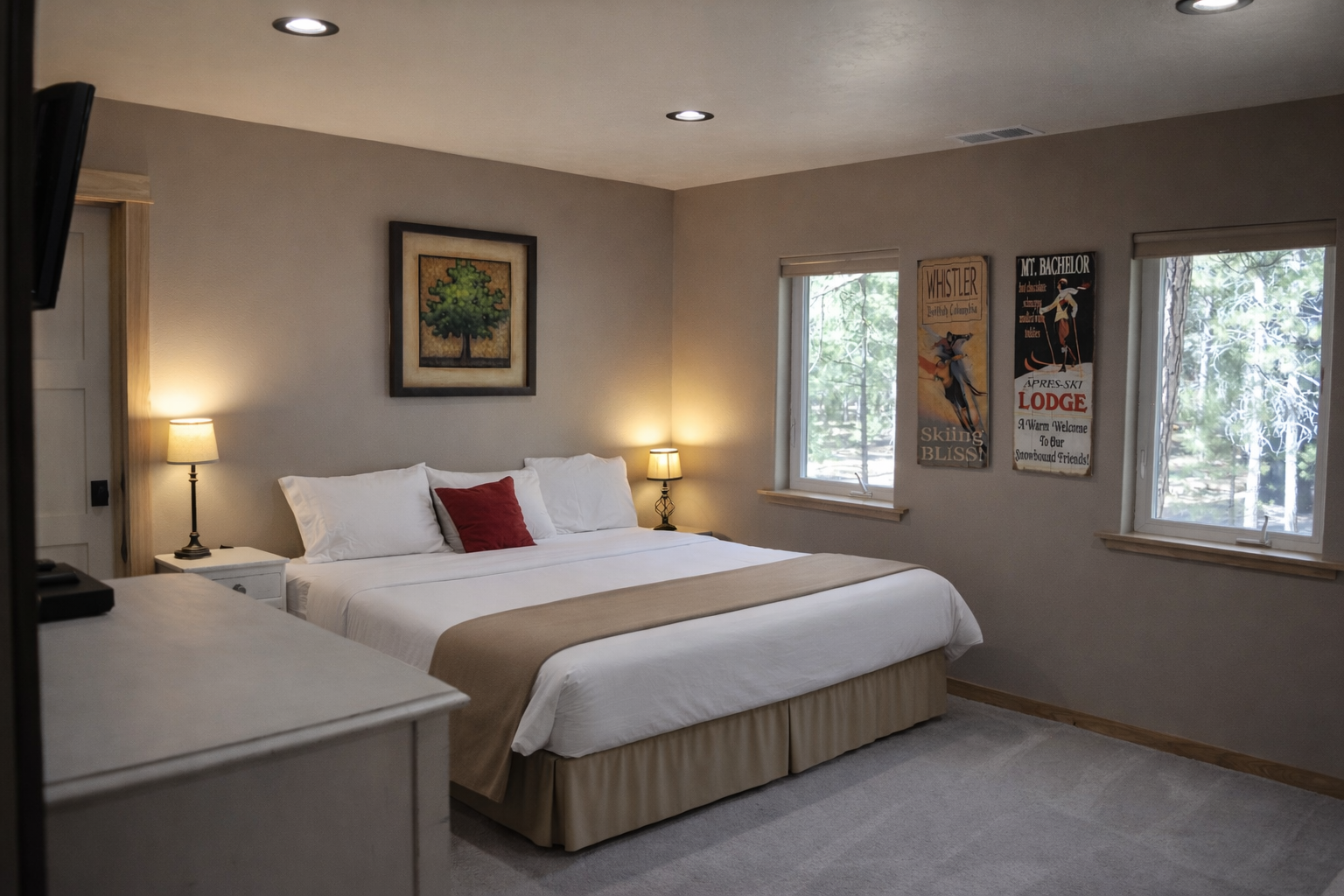 Unwind in your peaceful bedroom with crisp linens, warm lighting, and scenic forest views—your perfect retreat.