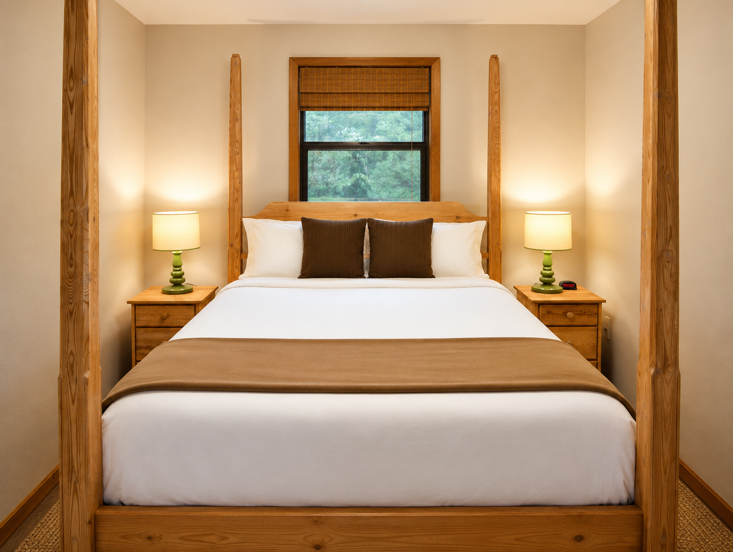 Sink into crisp linens and cozy wood furnishings in your private bedroom, where natural light and warm bedside lamps create a serene retreat after your day of adventure.