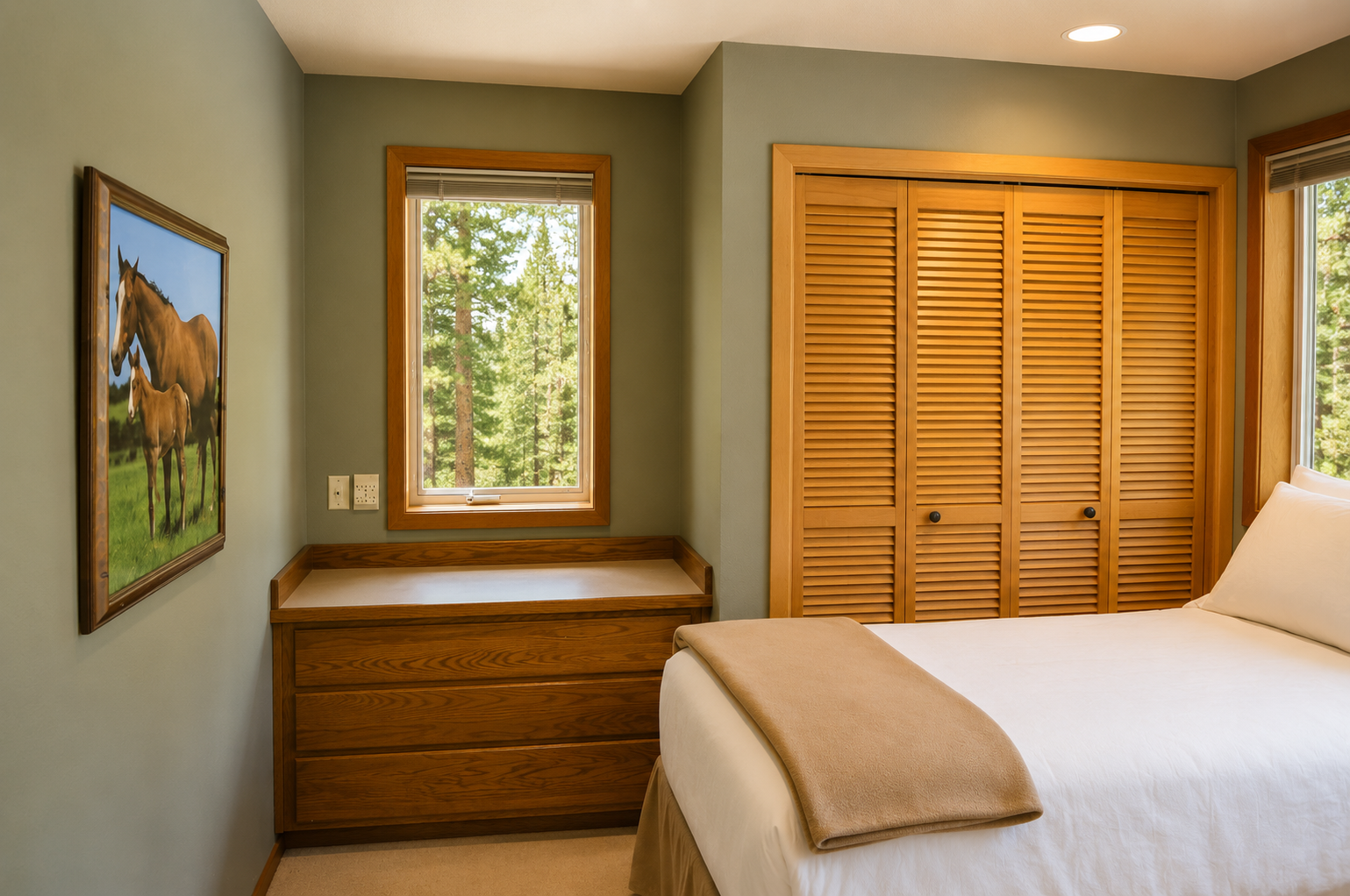 Settle into crisp linens and gaze out at lush forest views from your serene bedroom retreat with warm wood accents and ample closet space.