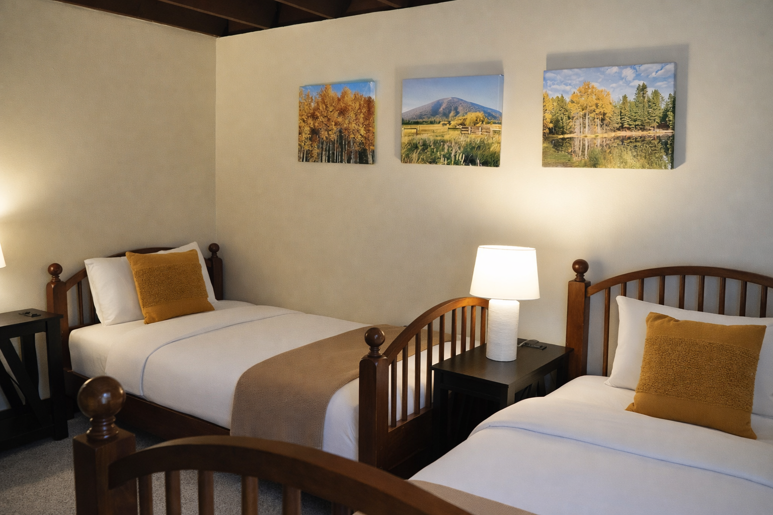 Drift off to sleep in your cozy twin beds surrounded by autumn mountain artwork and warm wooden beams overhead.