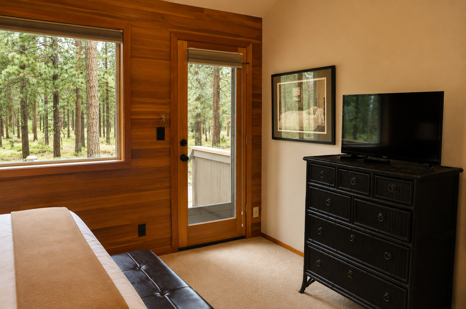Step outside from your bedroom to explore the tranquil forest beyond, or unwind inside while watching TV amidst serene woodland views framing your peaceful retreat.