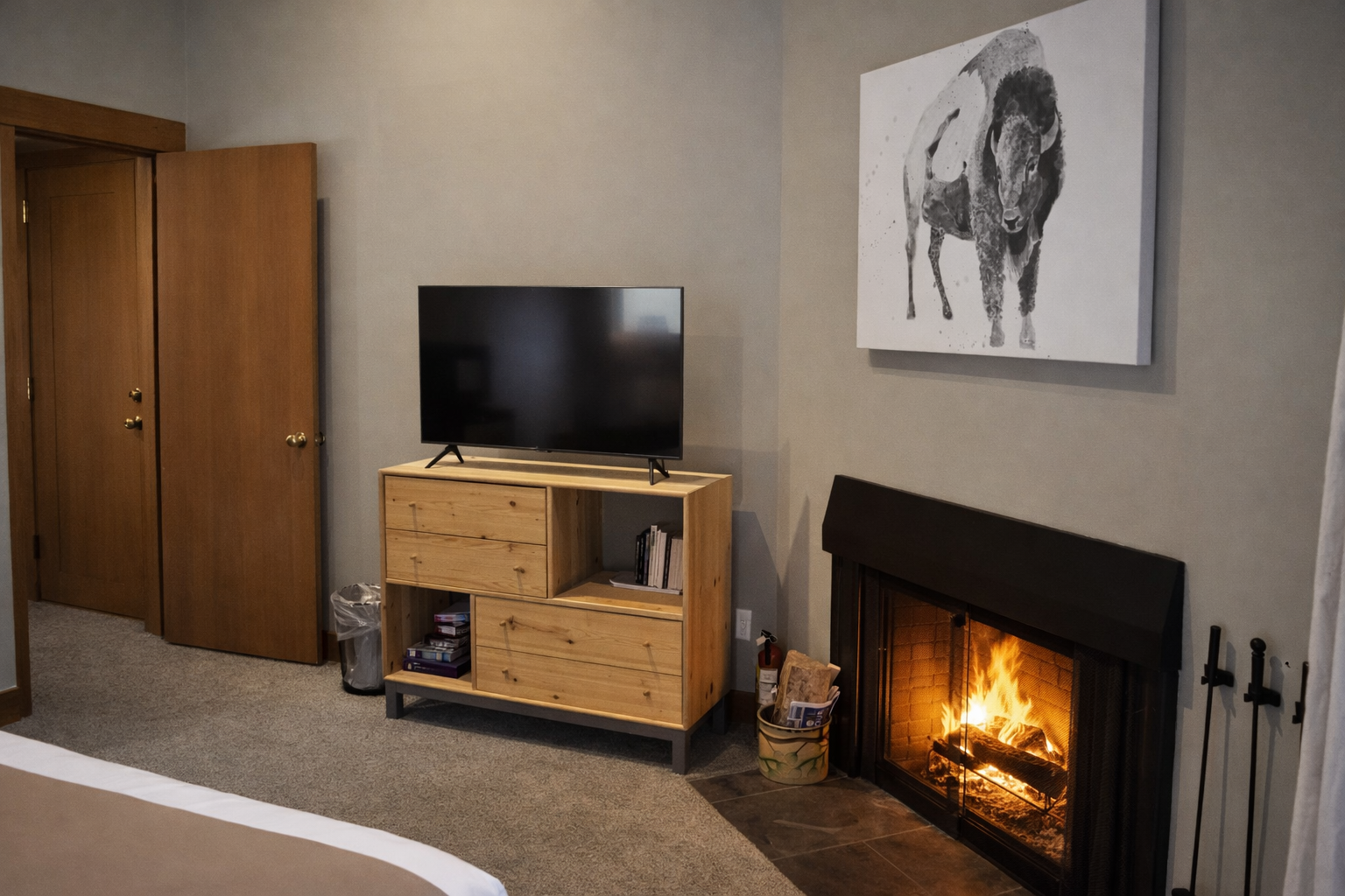 Cozy up by your crackling fireplace while watching TV in this warm, inviting space designed for perfect relaxation.