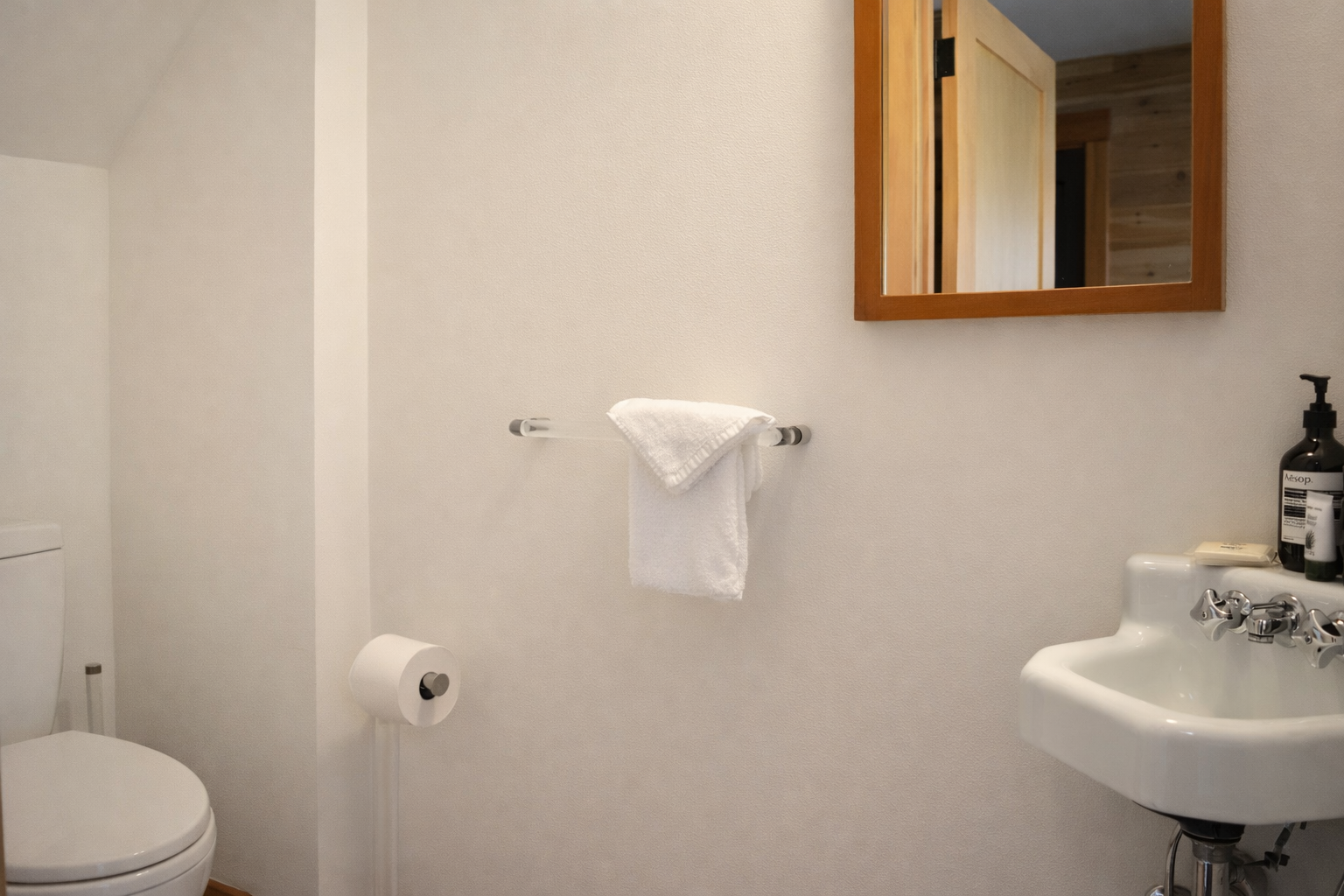 Your private bathroom features crisp white towels and modern amenities for a refreshing start to your day.