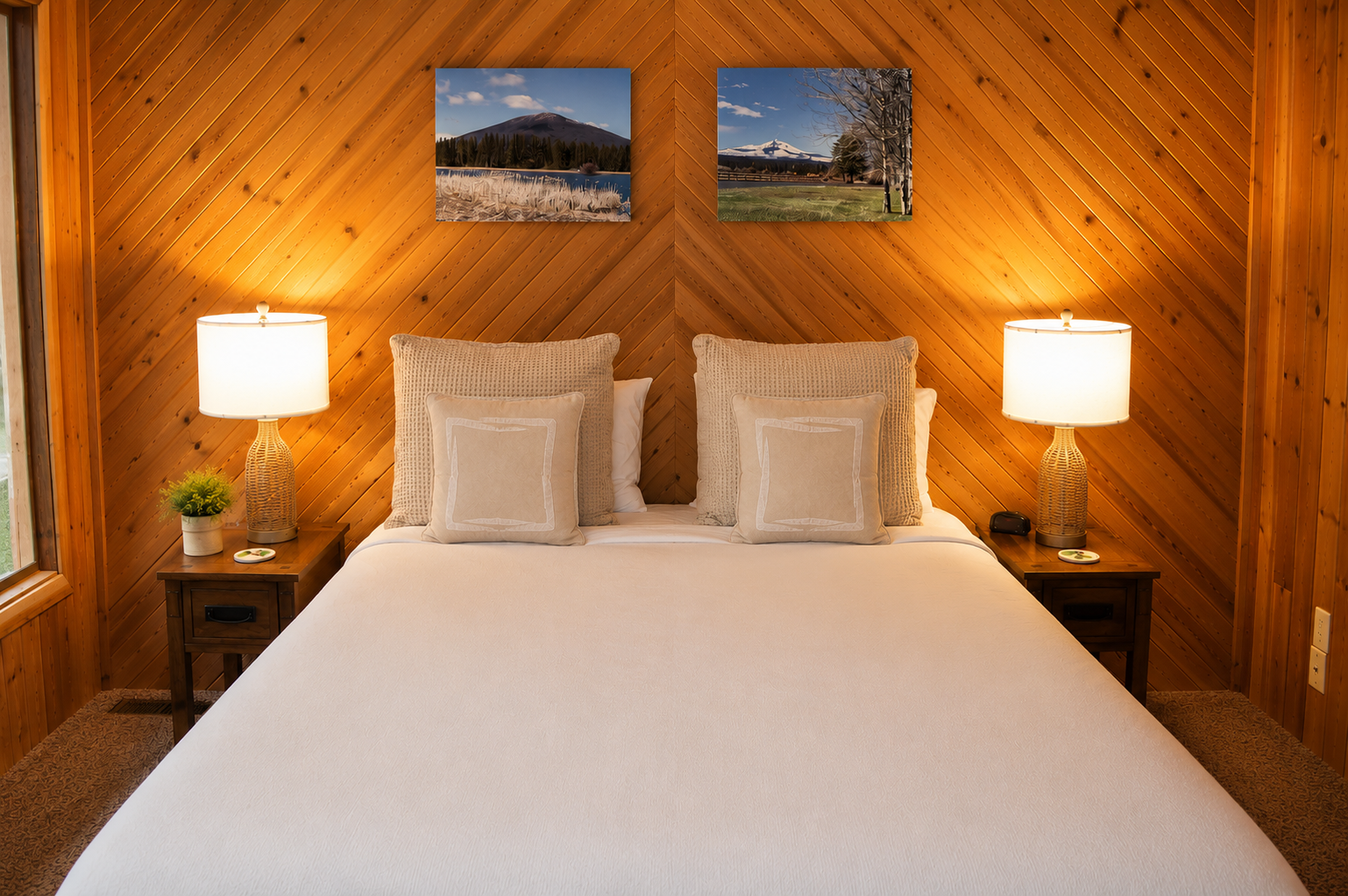 Sink into crisp linens beneath warm wood paneling, with nature-inspired art above your bed setting the scene for mountain dreams.