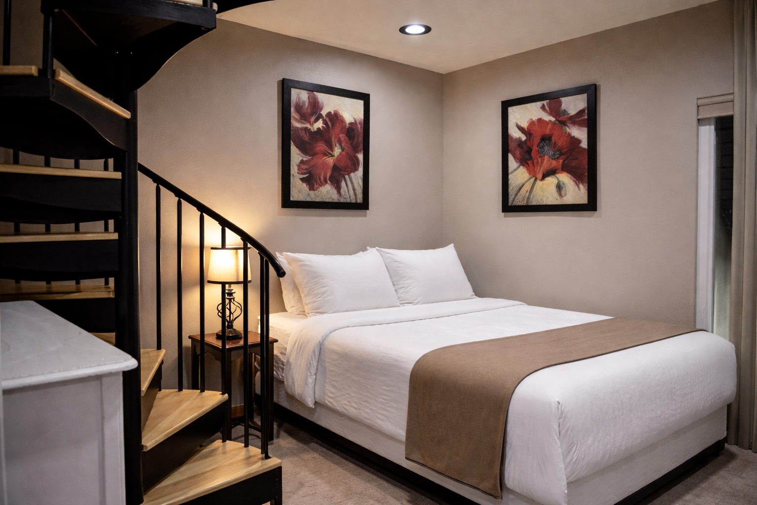 Sink into crisp white linens in your cozy bedroom, where warm lighting and thoughtful artwork create the perfect retreat after exploring.